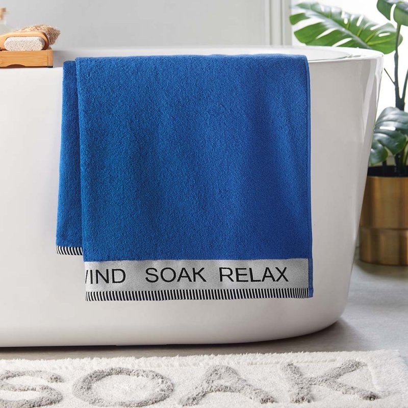 Catherine Lansfield Relax & Unwind Hand Towel Cobalt Blue Lifestyle on Bath