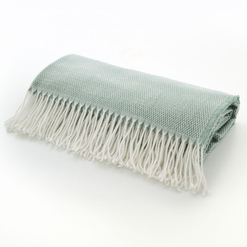 The Lyndon Company Arcadia Jacquard Throw 130cm x 170cm Sage Lifestyle on Bench