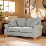 Hazel 2 Seater Sofa Fabric Minco Samur Teal With Country Oak Leg Lifestyle