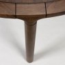Storm 6-8 Person Round Dining Table Walnut Leg Close Up