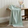 The Lyndon Company Arcadia Jacquard Throw 130cm x 170cm Sage Lifestyle on Bench