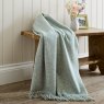 The Lyndon Company Arthington Jacquard 130cm x 180cm Throw Green Lifestyle on Bench
